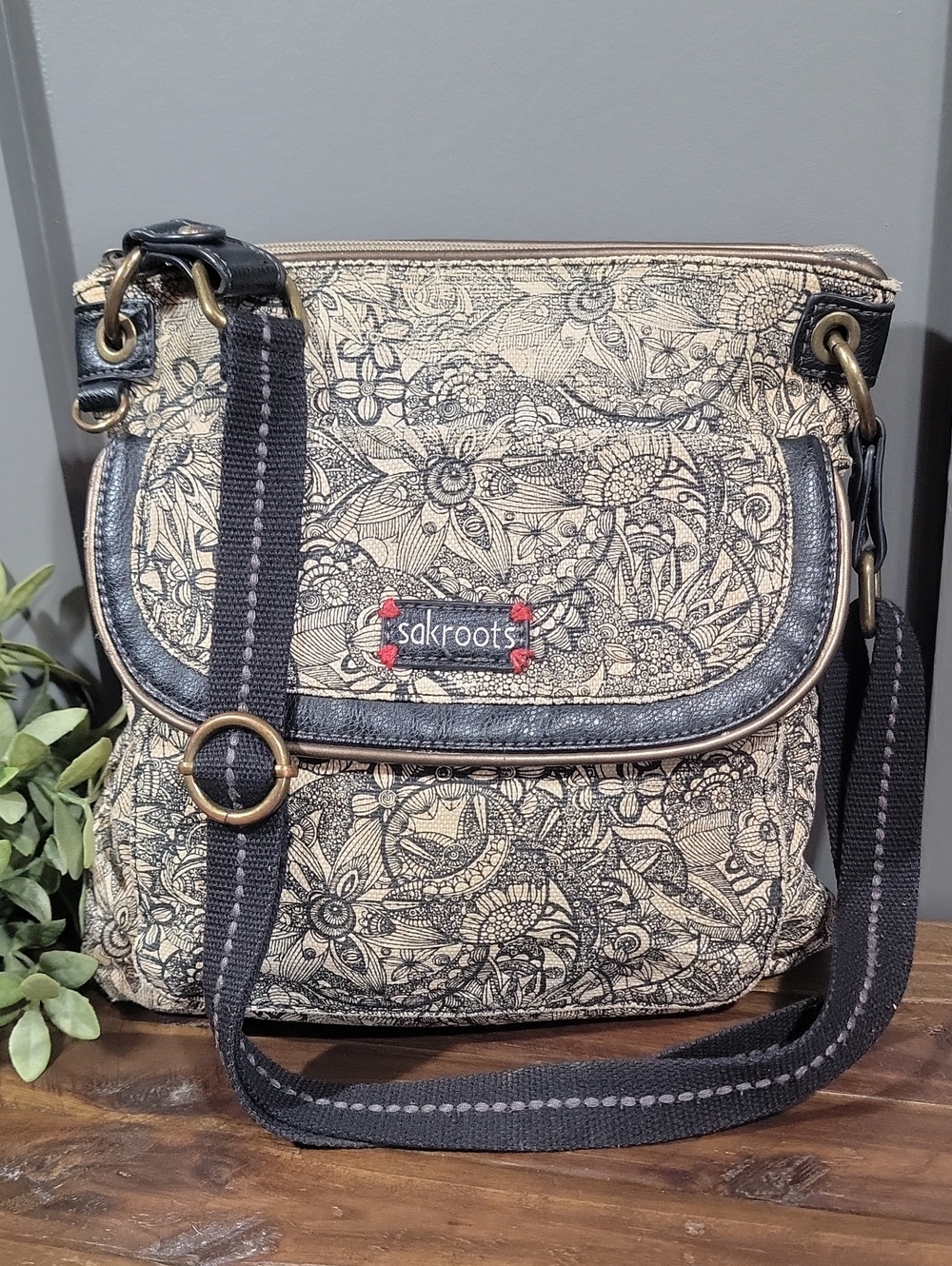 Sakroots Beige Floral Crossbody with Black Trim and Strap